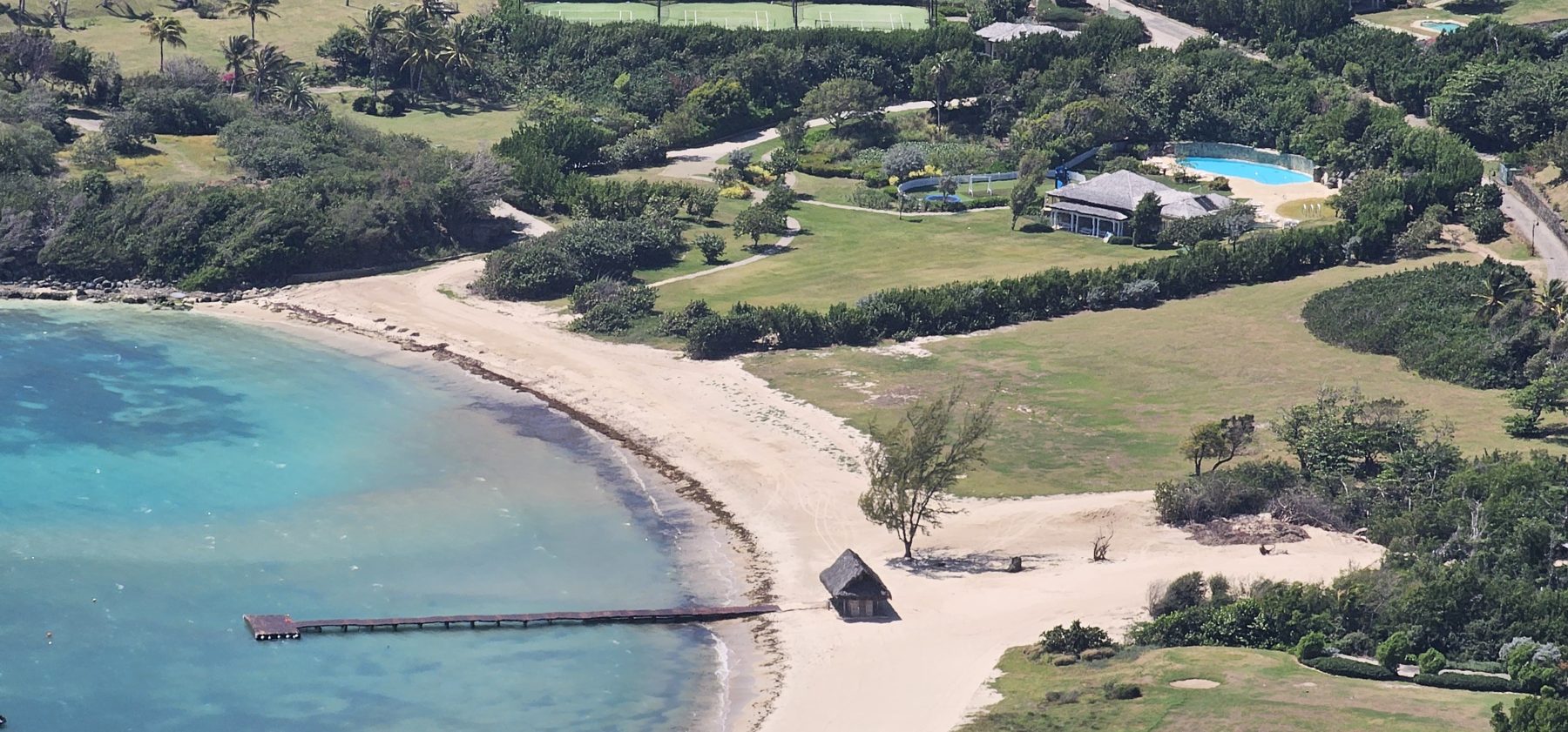 White sand and gardens below the trail