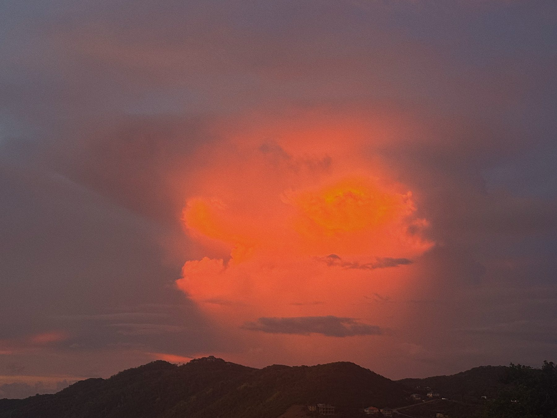 Fire-red sunset over the hills