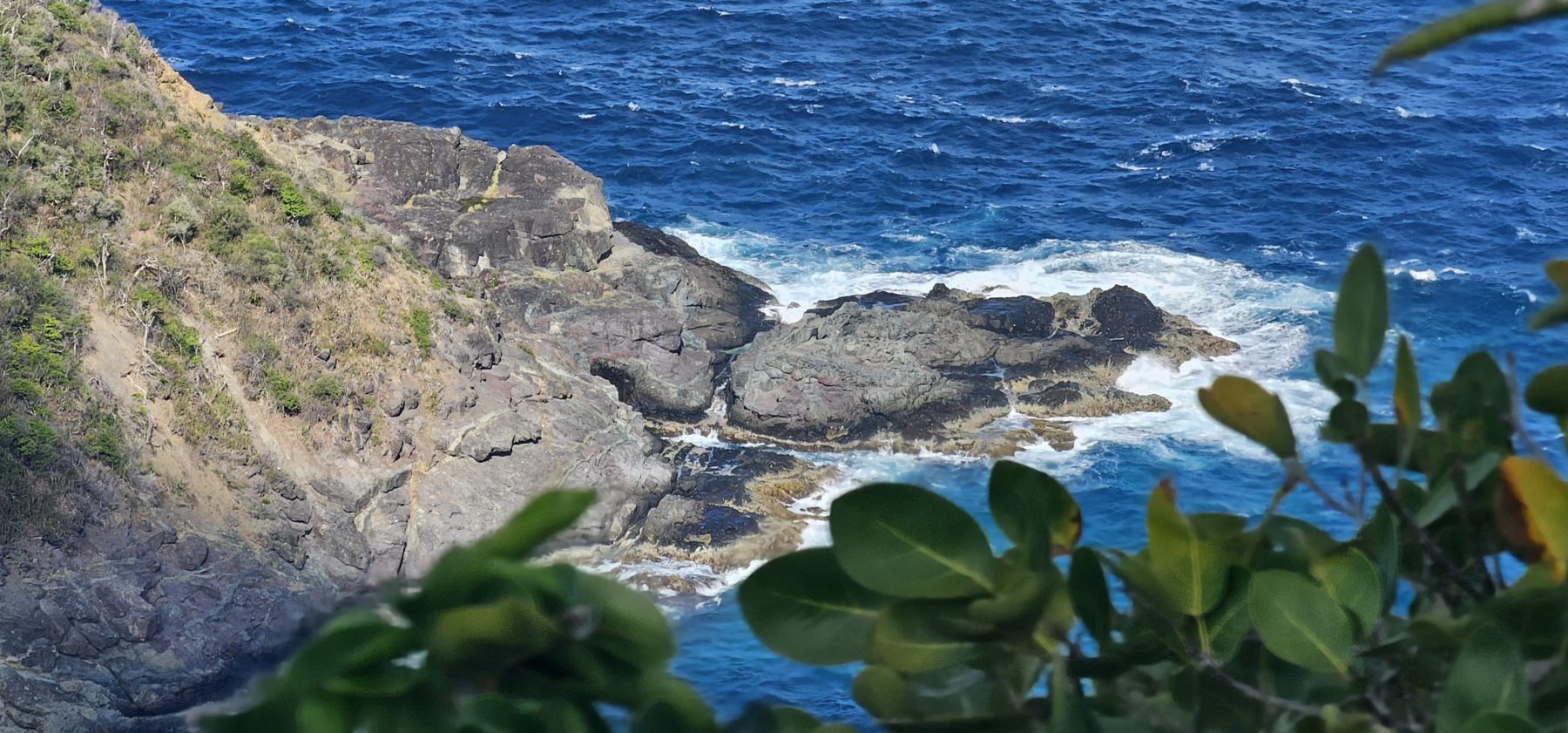 Waves working the rocky windward cove